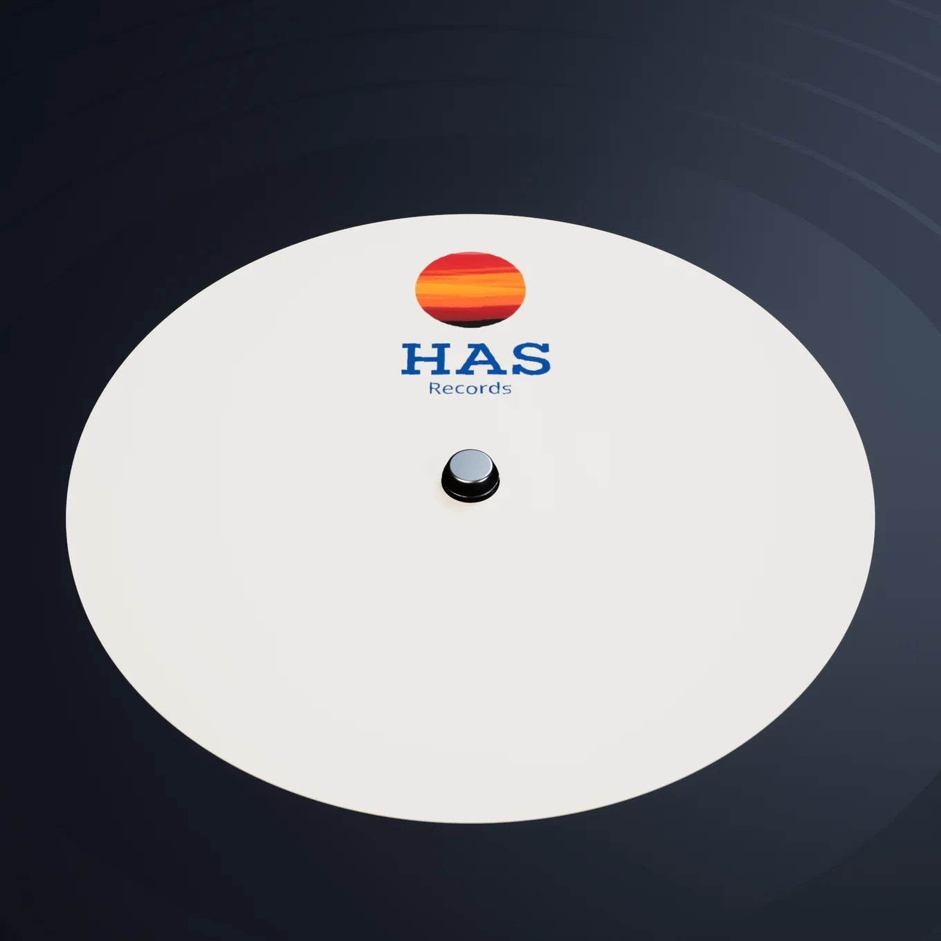 Close-up of the HAS Records centre label: a sunset disc above the navy HAS Records wordmark on cream paper, on a black LP