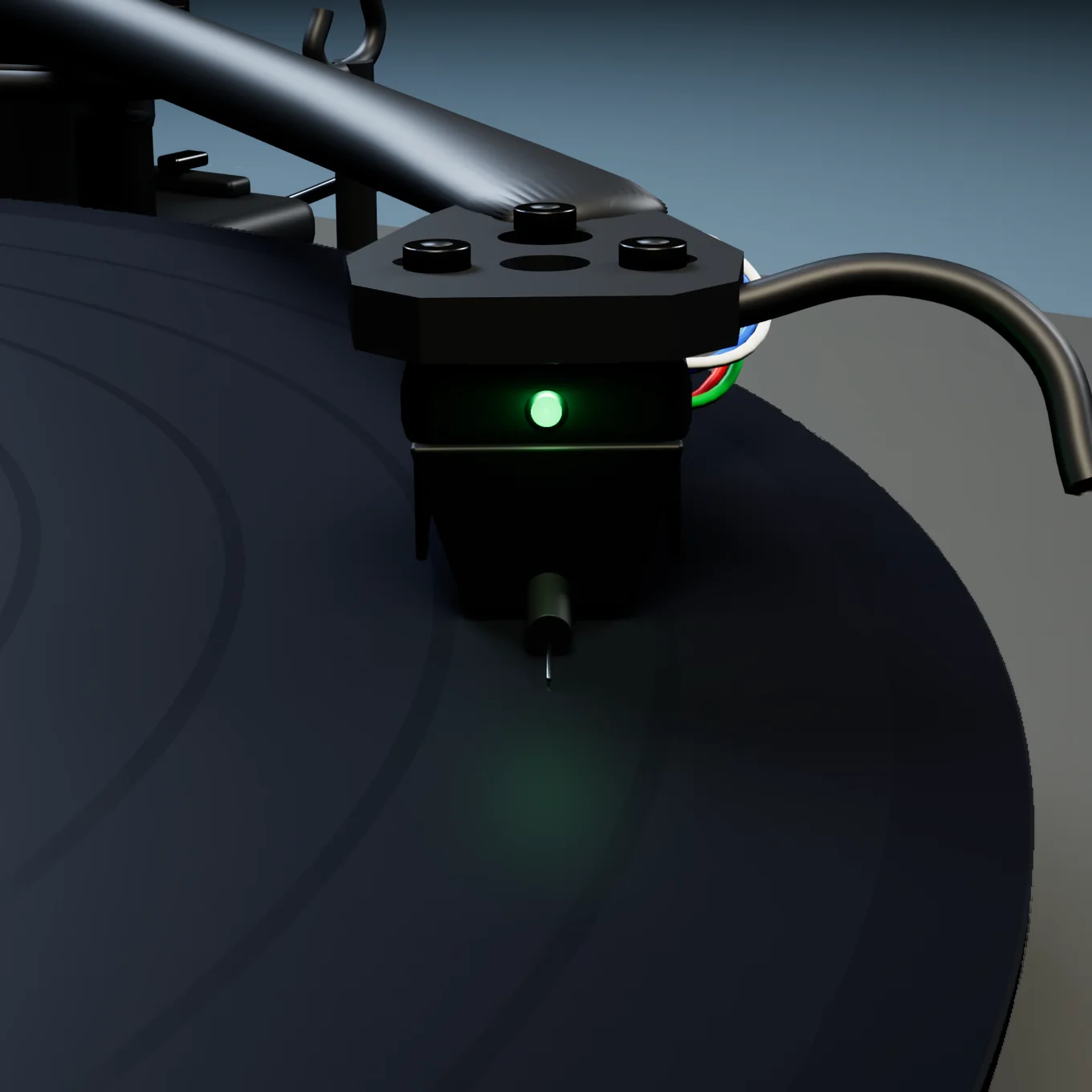 The Nd9 cartridge in the groove, with a small green light glowing on its front and a faint green glow on the vinyl below