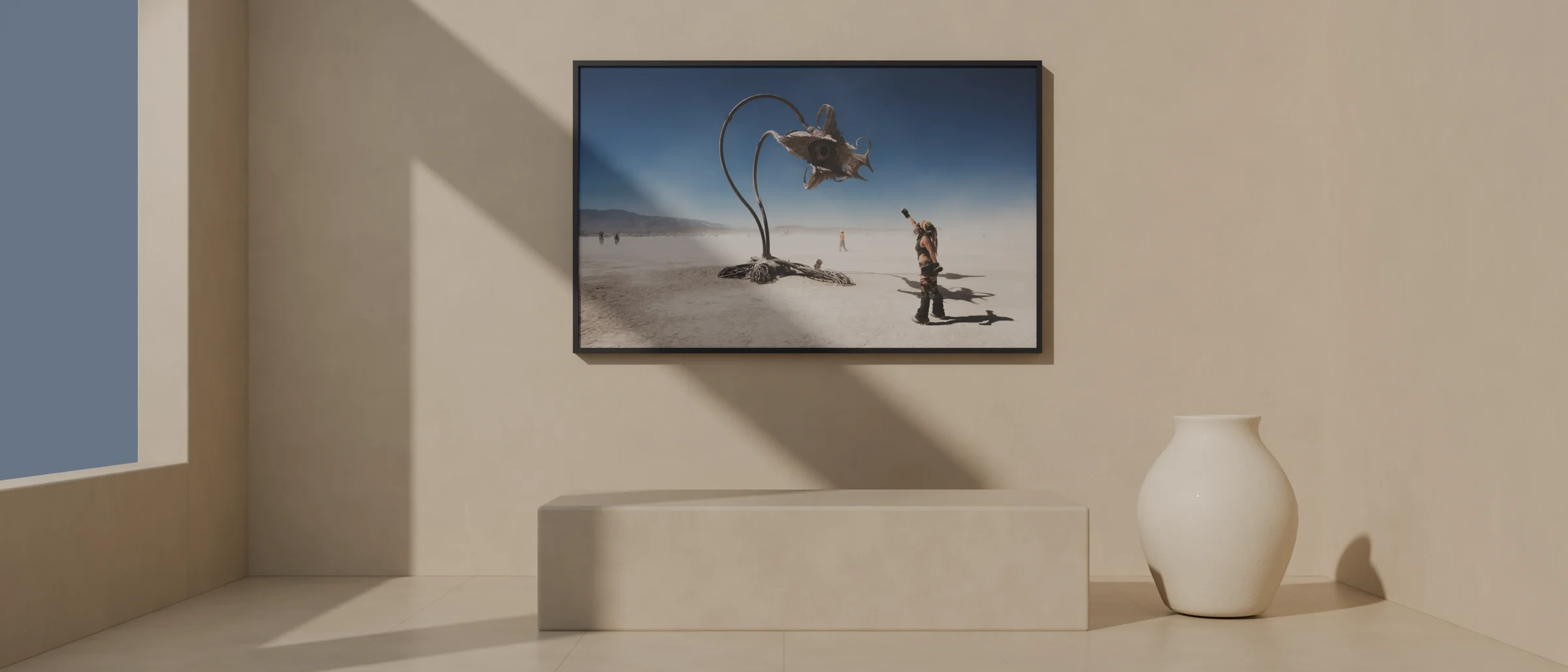 A HAS Space render: a limewash gallery room with a large framed Burning Man photograph centred over a stone plinth, a white ceramic vessel on the floor beside it, and a diagonal of sunlight